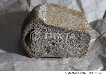 Bread baked from whole grain flour. 89048423