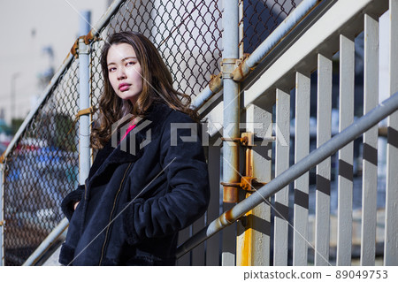 Portrait of a woman in the city Portrait of a woman in the city 89049753