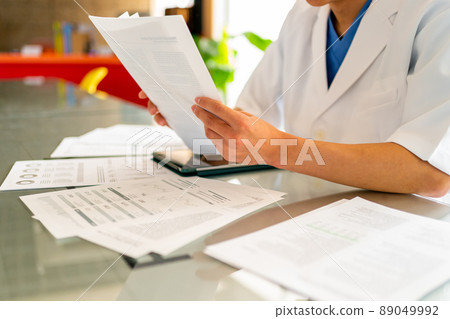 Men in lab coats and tablets Men in lab coats and tablets 89049992