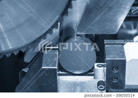 Close up scene the automatic band saw machine cutting the metal rod. 89050314