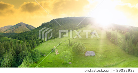 Wide-angle panoramic shot of beautiful meadows, hills and trees in Synevyrska glade next to Synevyr lake. Majestic and wonderful landscapes of the Carpathian mountains in Ukraine 89052952