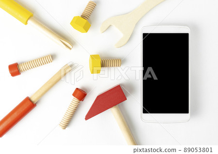 Toy tools and smartphones. Image of repair 89053801