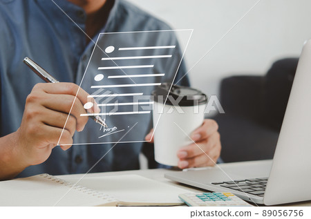 businessman holding pen business digital signing documents on virtual screen. 89056756