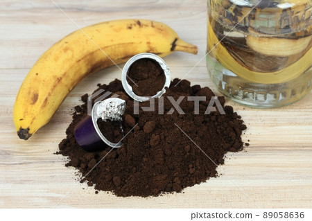 Coffee grounds from espresso coffee capsules and banana peels for plants better growing. 89058636