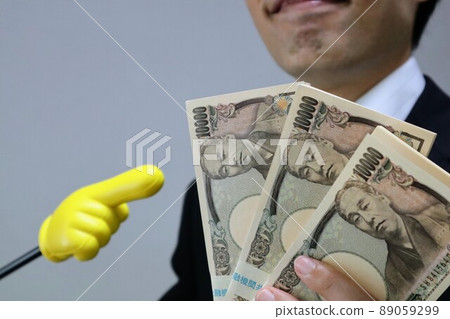 Businessman with a bundle Businessman with a bundle 89059299
