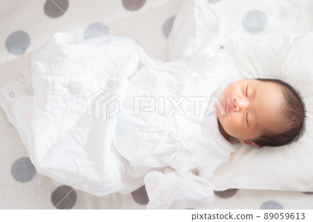 11-day-old newborn baby sleeping face 89059613