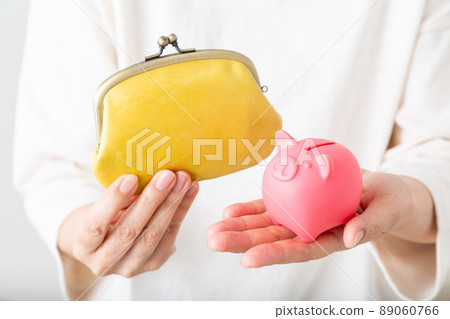 Middle woman with piggy bank 89060766