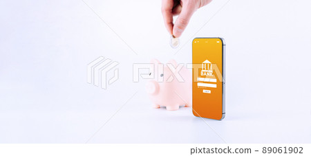 E banking concept. Mobile phone with internet online bank app. Pig bank with hundred dollar bill on white background. Online wallet save money. 89061902