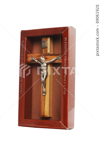 Wooden crucifix standing in box on white background Wooden crucifix standing in box on white background 89061928