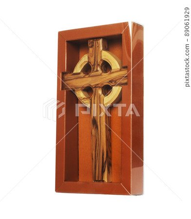 Wooden crucifix standing in box on white background Wooden crucifix standing in box on white background 89061929