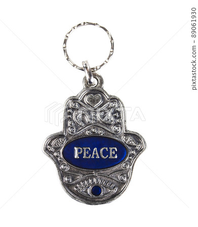 Metal hamsa for peace isolated on white background Metal hamsa for peace isolated on white background 89061930