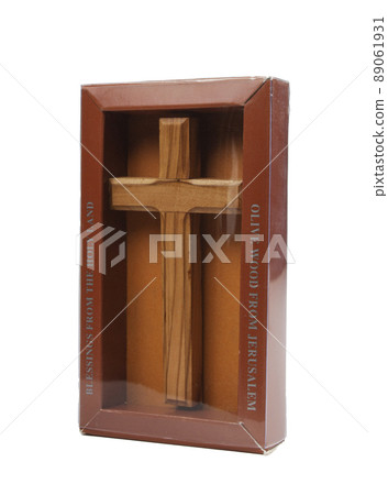 Wooden crucifix standing in box on white background 89061931
