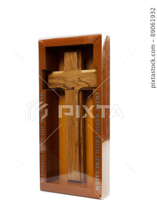 Wooden crucifix standing in box on white background Wooden crucifix standing in box on white background 89061932