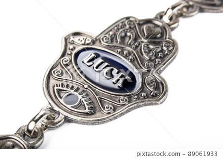 Metal hamsa for luck isolated on white background 89061933
