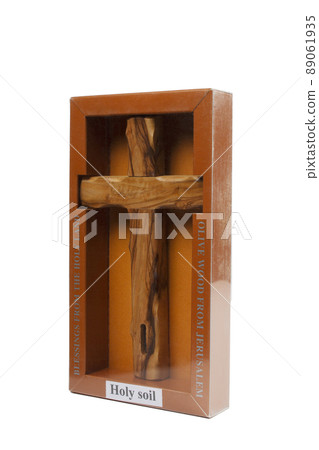 Wooden crucifix standing in box on white background Wooden crucifix standing in box on white background 89061935
