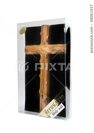 Wooden crucifix standing in box on white background Wooden crucifix standing in box on white background 89061937