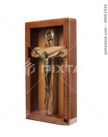 Wooden crucifix standing in box on white background Wooden crucifix standing in box on white background 89061938