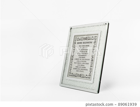 A shining silver picture frame with blessing home on white background. A shining silver picture frame with blessing home on white background. 89061939