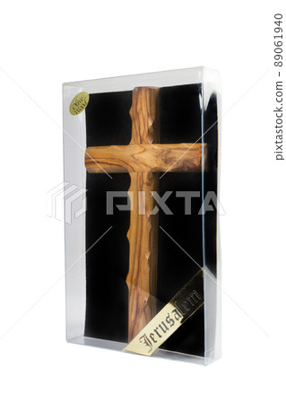 Wooden crucifix standing in box on white background Wooden crucifix standing in box on white background 89061940