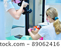Dentist photographing teeth before teeth whitening procedure. 89062416
