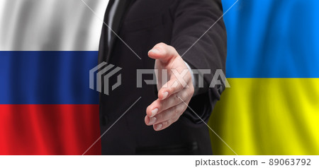 Open hand on flags of Ukraine and Russia background. Peace talks concept Open hand on flags of Ukraine and Russia background. Peace talks concept 89063792