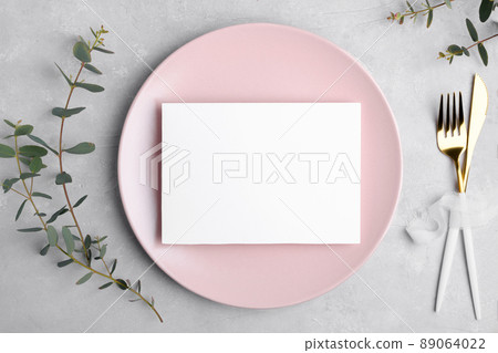 Wedding stationery invitation card mockup 7x5 on grey background with eucalyptus, Menu card mockup with table setting 89064022