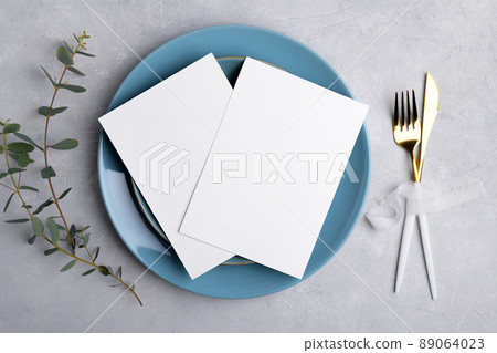 Two Wedding invitation card mockup 5x7 on grey background with eucalyptus, Menu card mockup with table setting 89064023