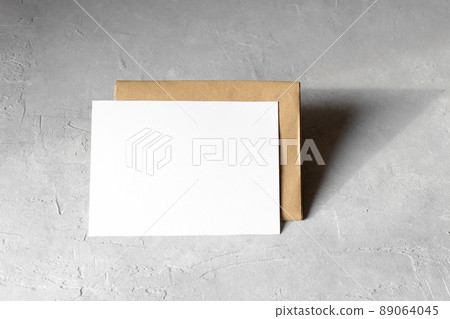 Wedding stationery invitation card mockup 5x7 on neutral grey background with envelop 89064045