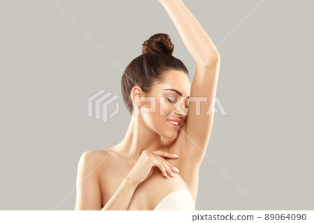 Armpit epilation, lacer hair removal. Young woman holding her arms up and showing clean underarms, depilation smooth clear skin .Beauty portrait. Armpit epilation, lacer hair removal. Young woman holding her arms up and showing clean underarms, depilation smooth clear skin .Beauty portrait. 89064090