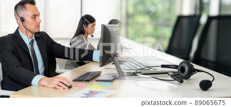 Business people wearing headset working in office broaden view 89065675