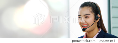 Business people wearing headset working in office in widen view 89066461