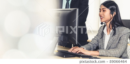 Business people wearing headset working in office broaden view Business people wearing headset working in office broaden view 89066464