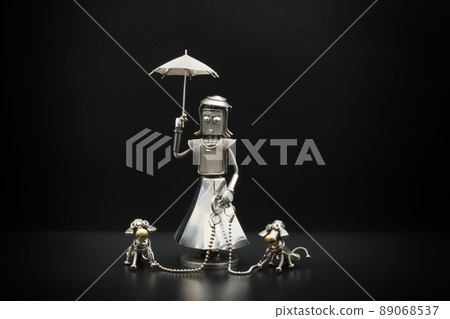 A model of a lady walking a dog, metal figure A model of a lady walking a dog, metal figure 89068537