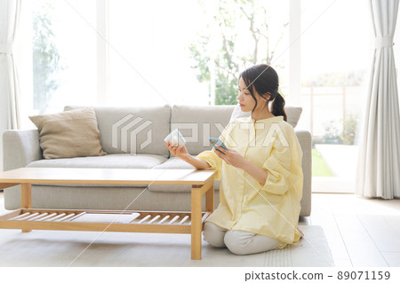 A woman relaxing at home 89071159