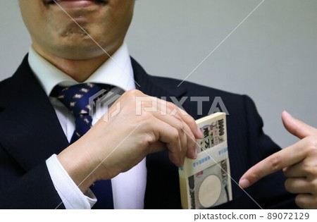 Businessman with a bundle Businessman with a bundle 89072129