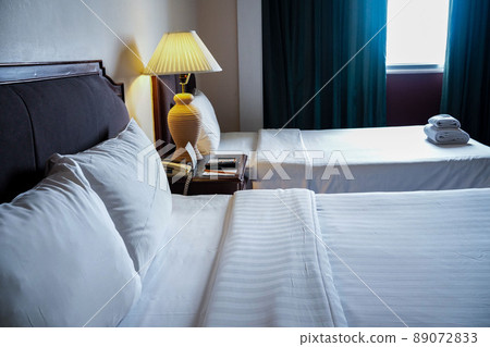 Towels and bedding on double beds in dormitories or guesthouse rooms that are empty. Towels and bedding on double beds in dormitories or guesthouse rooms that are empty. 89072833