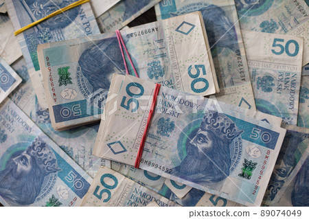 Close-up view of a file of fifty-zloty banknotes. Polish national currency. Close-up view of a file of fifty-zloty banknotes. Polish national currency. 89074049