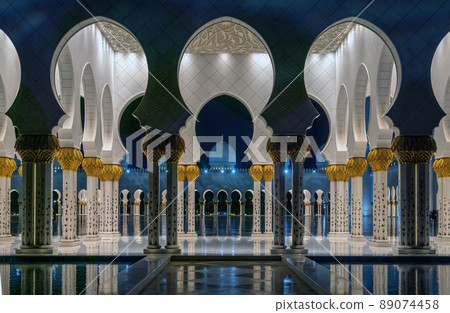 Abu Dhabi, United Arab Emirates - February 2022: Sheikh Zayed Grand Mosque interior in Abu Dhabi in the evening Abu Dhabi, United Arab Emirates - February 2022: Sheikh Zayed Grand Mosque interior in Abu Dhabi in the evening 89074458