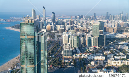 Abu Dhabi, United Arab Emirates - February 2022: Panoramic Abu Dhabi city skyline in United Arab Emirates. Abu Dhabi attracts 10 million people annually. 89074471
