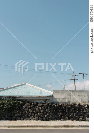Jeju Olle Trail countryside village street in Jeju island, Korea 89075432