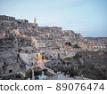 At nightfall in Matera, a World Heritage Site in Italy, where the lights begin to light up 89076474