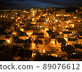 Matera, an Italian World Heritage Site surrounded by night light 89076612