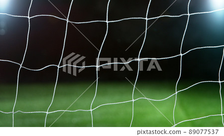 Detail of soccer net with lawn, black background. Detail of soccer net with lawn, black background. 89077537