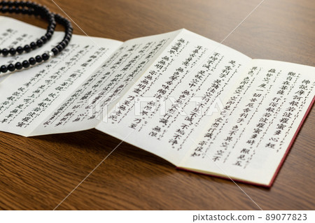 Buddhist chant spread on the desk Buddhist chant spread on the desk 89077823
