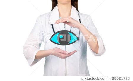 Female doctor with a stethoscope is holding mockup eye in the hands. Help and care concept 89081723