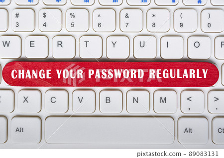 Change your password regularly text on wooden stick placed on laptop or notebook 89083131