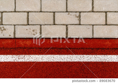 Red soft rubber matt jogging track and tile pavement Red soft rubber matt jogging track and tile pavement 89083670