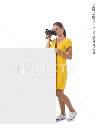 Photographer girl with blank banner 89083880