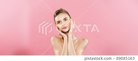 Beauty Concept - Beautiful Caucasian woman with clean skin, natural make-up isolated on bright pink background with copy space. 89085163