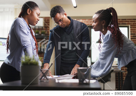 Marketing agency executive board discussing about bankruptcy possibility and poor management. Development company business people talking about marketing solutions while in office 89085500